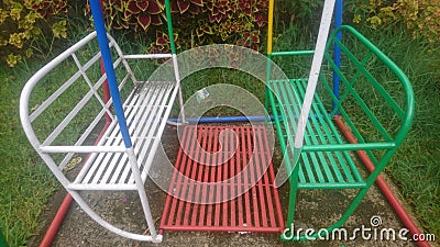 colorful swings in the garden Stock Photo