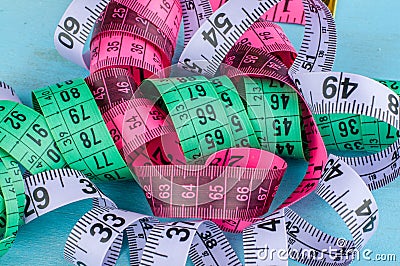 Colorful tapemeasure on blue background Stock Photo