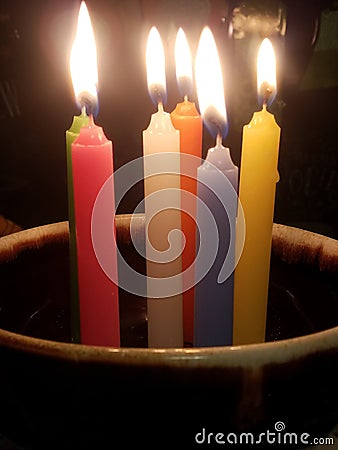 Colorful tapir candles in a bowl ritual or relaxation meditation style Stock Photo