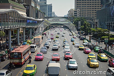 Colorful taxi cars wait in the traffic in the business district Editorial Stock Photo