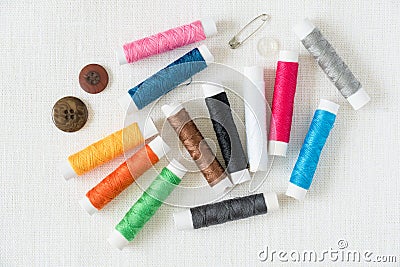 Colorful thread bobbins sewing concept image top view Stock Photo