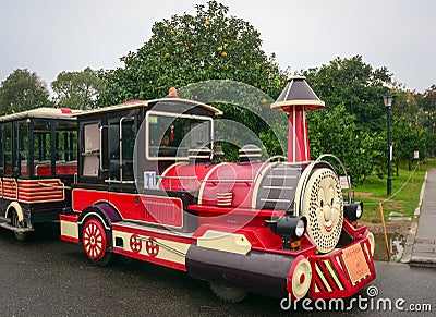 Colorful toy train carrying tourists Editorial Stock Photo