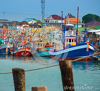 Colorful Traditional Thai Fishing Boats in the marina Editorial Stock Photo