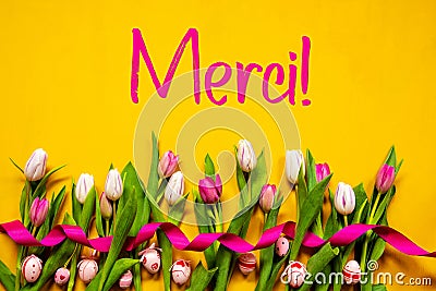 Colorful Tulip, Merci Means Thank You, Easter Egg, Yellow Background Stock Photo