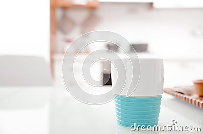 Colorful turquoise cup on a kitchen counter Stock Photo