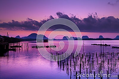 Colorful twilight in morning over seascape at fisherman village,Ban Sam Chong Tai , Pangnga,Thailand Stock Photo