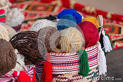 Colorful traditional thread for knitting, many clews in basket Stock Photo