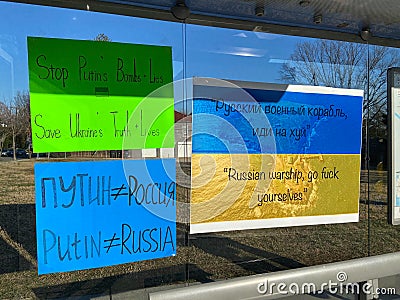 Colorful Ukrainian Protest Signs at the Bus Stop Editorial Stock Photo