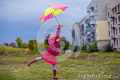 Colorful umbrella cute girl jump funny to sky Stock Photo