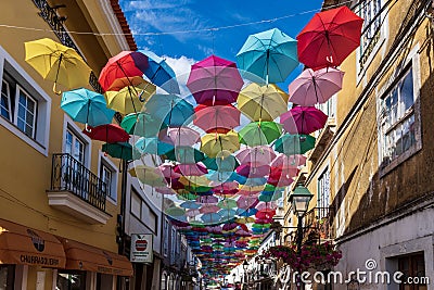 Colorful umbrellas hung over the streets of Agueda, Portugal Editorial Stock Photo