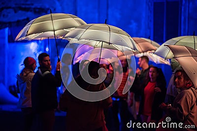 Colorful umbrellas illuminated by led lamps in the night Editorial Stock Photo