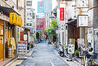 Colorful urban quiet street in Japan with various shop business street sign banner in the city. Editorial Stock Photo