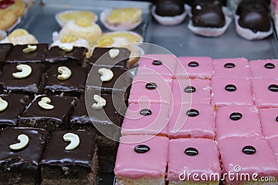 Colorful and variety cakes background on an open shop at Kolkata with selective focus. Stock Photo