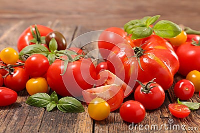 colorful variety of tomatoes and basil Stock Photo