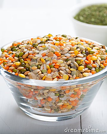 Colorful various beans or lentils and whole grains seeds or cereal in bowl with peppermint Stock Photo