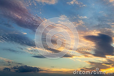 Colorful vibrant dramatic sky with orange to blue clouds colors. Sunset time. Beautiful nature background Stock Photo