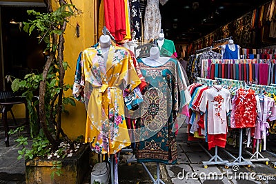 Colorful Vietnamese traditional dress for women and kids for sale in Hoi An, Vietnam Stock Photo