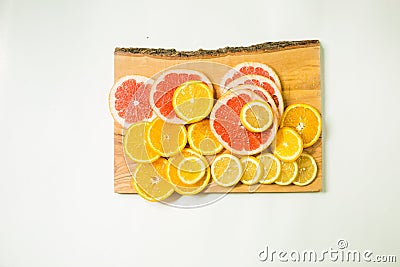 Colorful vitamin C fruits on woden cutting board Stock Photo