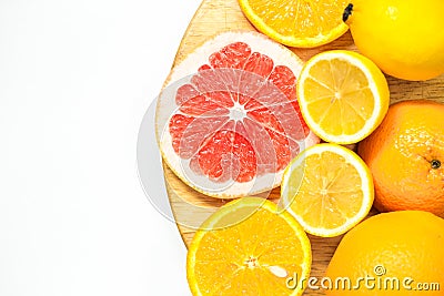 Colorful vitamin C fruits on woden cutting board Stock Photo