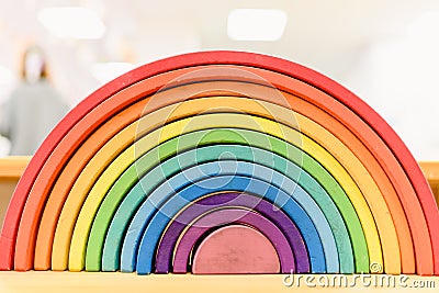 Colorful Waldorf wooden rainbow in a montessori teaching pedagogy classroom Stock Photo