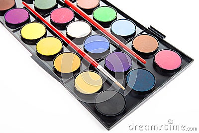 Colorful watercolors paints in palette with brushes isolated on Stock Photo