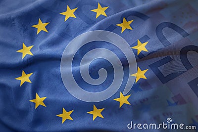 Colorful waving flag of european union on a euro money banknotes background. Stock Photo