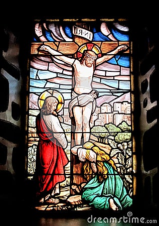 Colorful window with the image of the crucified Jesus Stock Photo