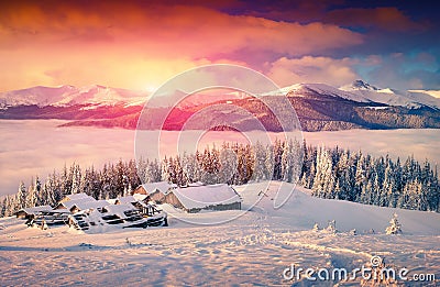 Colorful winter sunrise in foggy mountains Stock Photo