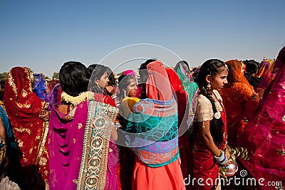 Colorful women in sari standing in crowd, India Editorial Stock Photo