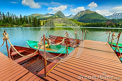 Colorful wooden boats on the alpine lake,Strbske Pleso,Slovakia Stock Photo