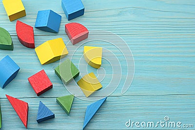 colorful wooden cubes on blue wooden background. Top view. Toys in the table Stock Photo