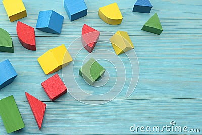 colorful wooden cubes on blue wooden background. Top view. Toys in the table Stock Photo