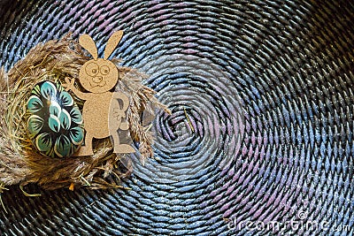 Colorful wooden easter egg and wooden fanny rabbit on a colorul background. Toned Stock Photo