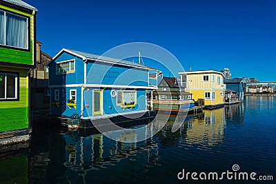 Colorful wooden floating houses on sunny summer day with blue sky Stock Photo