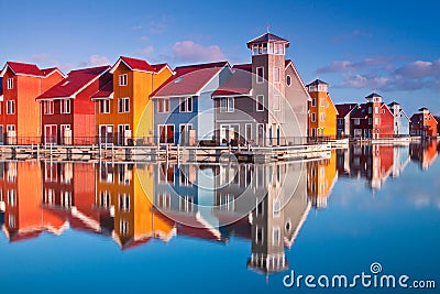 Colorful wooden houses near water Stock Photo