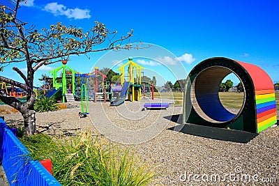 Colorful wooden Kids playground tunnel. Levin, New Zealand Stock Photo