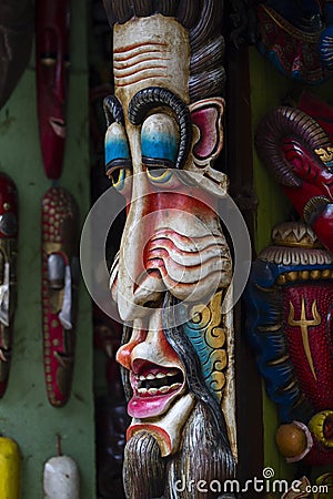 Colorful wooden masks and handicrafts on sale at shop in the Thamel District of Kathmandu, Nepal. Stock Photo