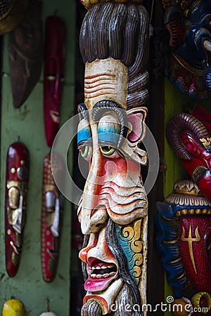 Colorful wooden masks and handicrafts on sale at shop in the Thamel District of Kathmandu, Nepal. Stock Photo