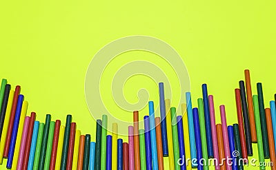 Colorful wooden sticks lay on yellow background Stock Photo
