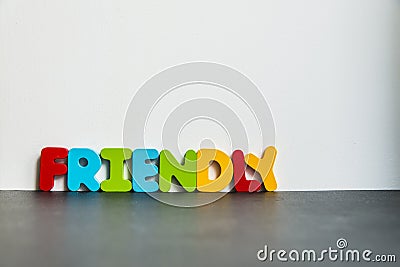 Colorful wooden word Friendly with white background1 Stock Photo