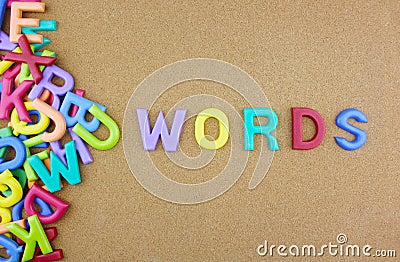 The colorful word `Words` over the wooden board. Stock Photo