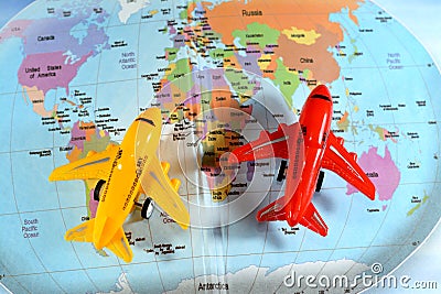 Colorful world map with airplane on it with the continents Africa, Europe, North America, Asia, South America, Australia and Stock Photo