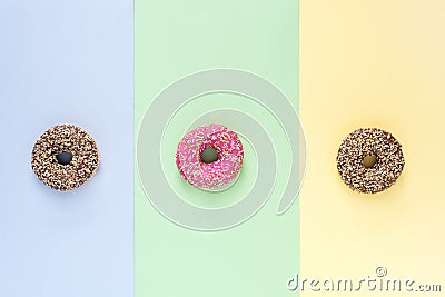 Colorfull Donuts with Icing on Colorfull Background Top View Three Tasty Donuts Horizontal Stock Photo
