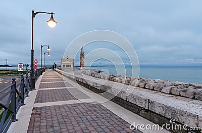 Colorfull embankment in Caorle with the church Stock Photo