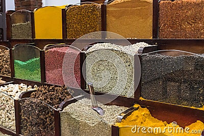 Colorfull jars of spices on a shelf in an oriental spice store Stock Photo