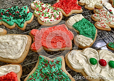 Colorfully iced, homemade Christmas cookies on a wire rack Stock Photo