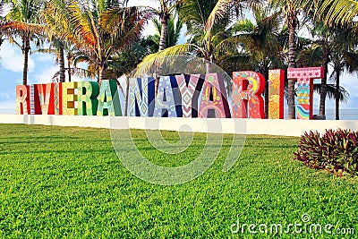 Colorfully painted Riviera Nayarit sign on a public beach in Mexico. Translation: Coastline Nayarit. Stock Photo