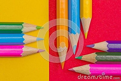 Coloring pencils on red and yellow background Stock Photo