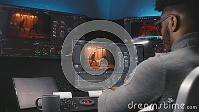 Colorist makes color grading on control machine Stock Photo