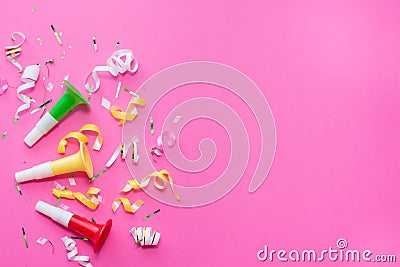 Colorul party streamers on pink background. Celebration concept. Flat lay Stock Photo